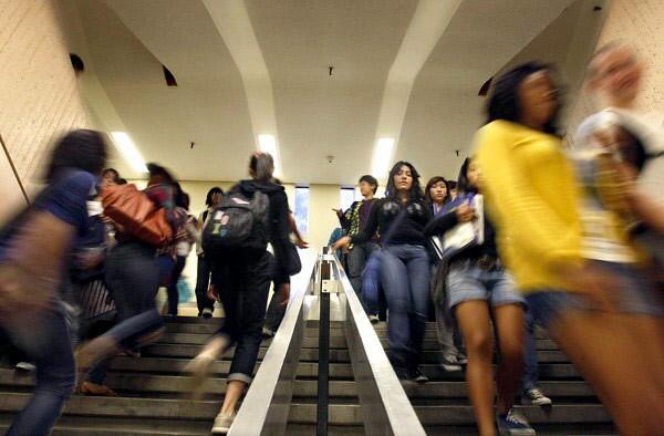 Students rush through the halls of Fairfax High School between classes. For some of the campus' 2,500 students, it's a race to find a seat in the next classroom, as many courses have more students than desks or chairs available.