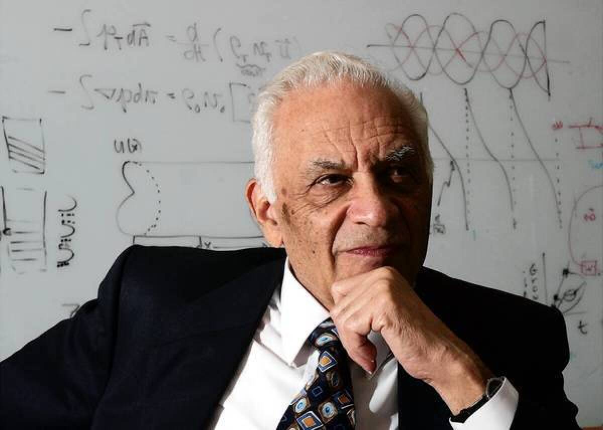 In this 2005 photograph, acoustics pioneer Amar Bose, chairman of Bose Corp., pauses during an interview with the Associated Press in his office in Framingham, Mass., where he founded the company in 1964.