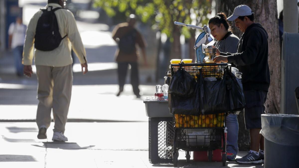 Street vendors selling goods in Los Angeles in 2017. The La Cañada Flintridge City Council introduced an ordinance Tuesday that regulates mobile and stationary vending.