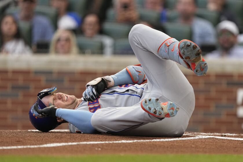 New York Mets first baseman Pete Alonso reacts after being hit by a pitch from Atlanta Braves starting pitcher Charlie Morton in the first inning of a baseball game, Wednesday, June 7, 2023, in Atlanta. Alonzo left the game and went into the clubhouse for treatment. (AP Photo/John Bazemore)