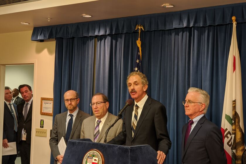 Los Angeles City Atty. Mike Feuer (center) announced on Thursday that his office is suing the FAA over the noise issues stemming from Hollywood Burbank Airport.