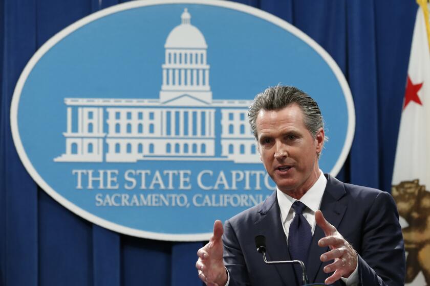 California Gov. Gavin Newsom discusses his proposed 2020-2021 state budget during a news conference in Sacramento, Calif., Friday, Jan. 10, 2020.. (AP Photo/Rich Pedroncelli)