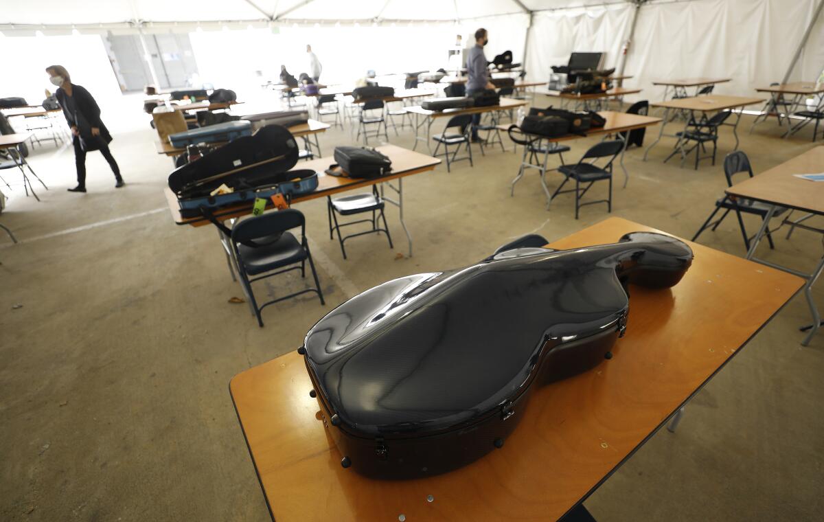 Instruments atop table-and-chair seating areas.