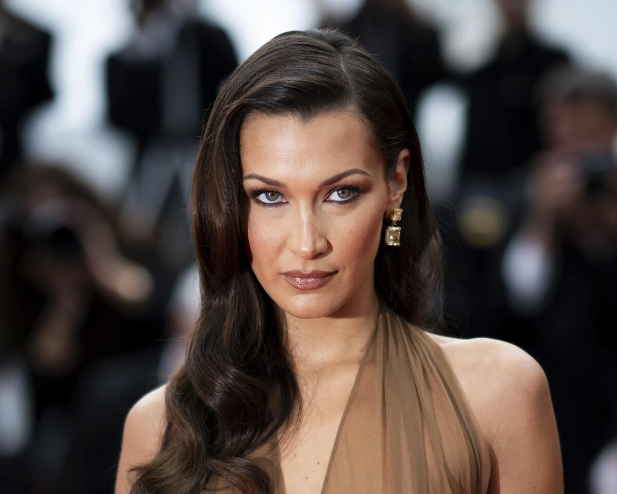 Adidas cuts Bella Hadid from retro ad campaign after backlash - Los Angeles Times Adidas cuts Bella Hadid from retro ad campaign after backlash - Los Angeles Times