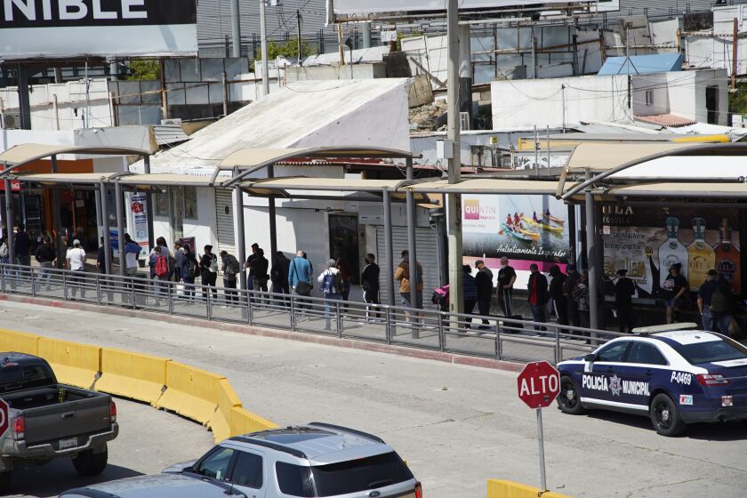 Tijuana, Baja California, Mexico April 21st, 2020 | Pedestrian traffic makes line at PedEast. Border traffic is back to two-hour waits for cars at the San Ysidro Port of Entry | (Alejandro Tamayo, The San Diego Union Tribune 2020)