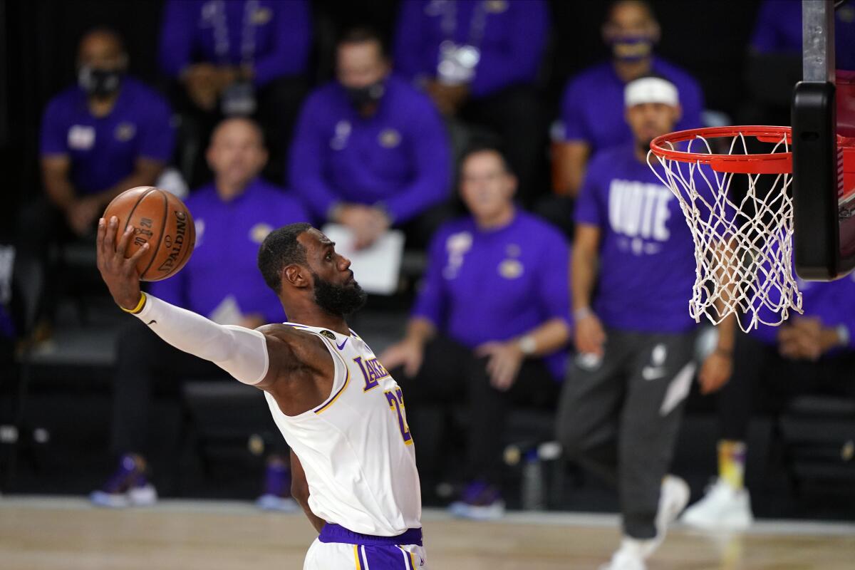 Lakers star LeBron James dunks during Game 6 of the 2020 NBA Finals in October.