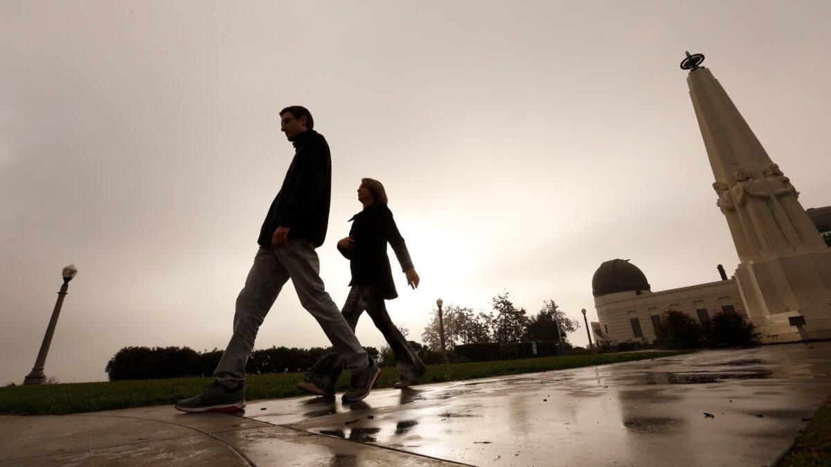 Scattered showers are likely in Los Angeles through Wednesday, but the light rains won’t do much to alleviate a dry start to the year, forecasters say. The last big rain in L.A. occurred in November, as seen here at Griffith Observatory.