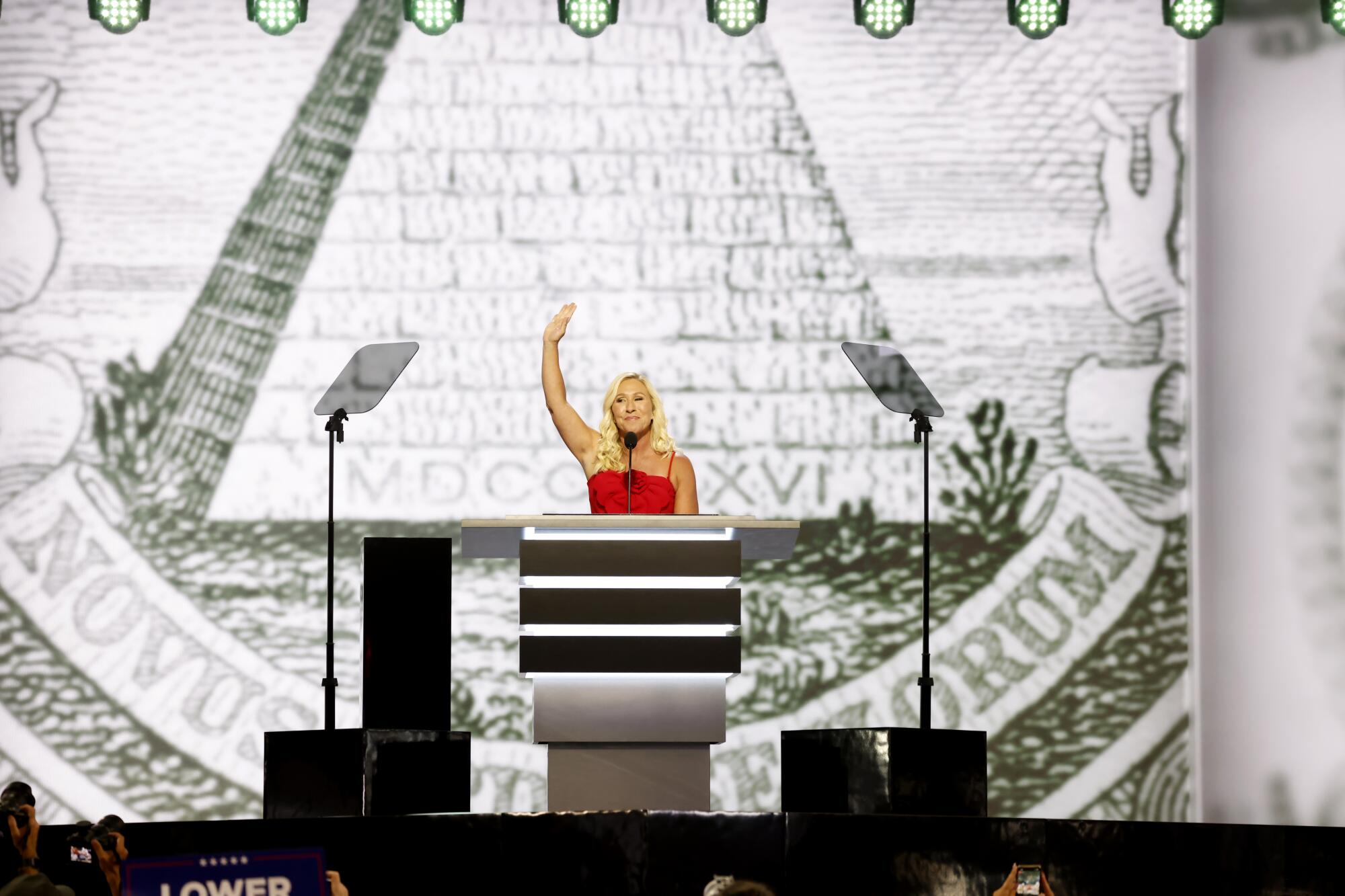 Rep. Marjorie Taylor Greene waves during the Republican National Convention.