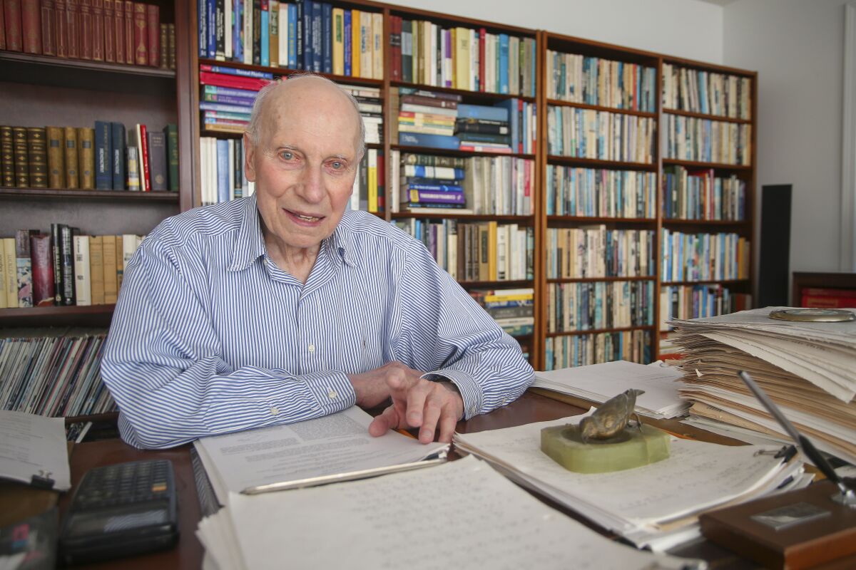 Manfred Steiner, who earned his Ph.D. in physics from Brown University at the age of 89, is photographed in his home office in East Providence, R.I., Wednesday, Nov. 10, 2021. After retiring from his career in medicine in 2000, Steiner pursued his dream of earning a doctorate in physics. (AP Photo/Stew Milne)