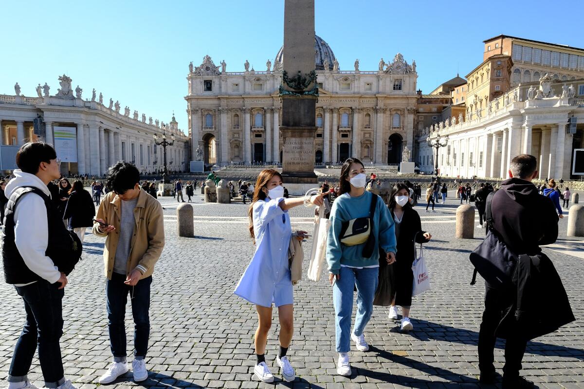 Masked tourists in Vatican City