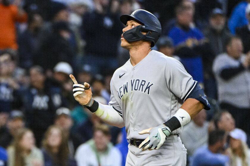 New York Yankees' Aaron Judge gestures after hitting a solo home-run against the Seattle Mariners during the seventh inning of a baseball game Tuesday, May 30, 2023, in Seattle. (AP Photo/Caean Couto)