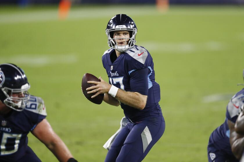 Tennessee Titans quarterback Ryan Tannehill (17) looks for a receiver in the first half of an NFL football game against the Buffalo Bills Tuesday, Oct. 13, 2020, in Nashville, Tenn. (AP Photo/Wade Payne)