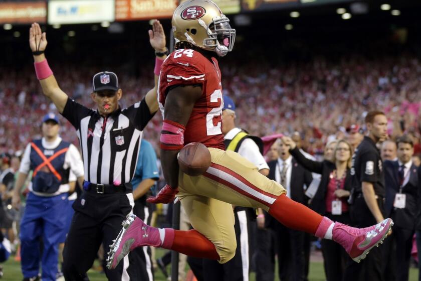 San Francisco running back Anthony Dixon leaps after scoring a first-half touchdown in the 49ers' 34-3 victory over the Houston Texans on Sunday night.