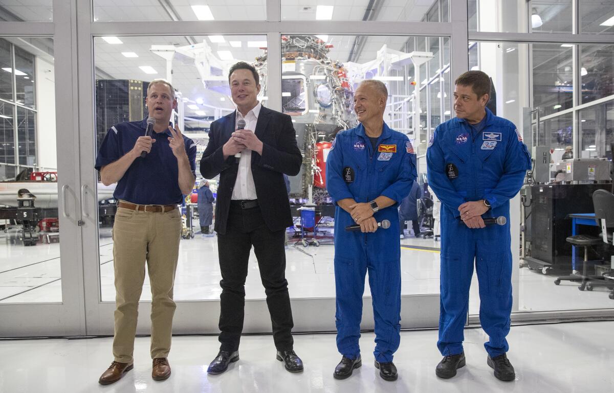 NASA Administrator Jim Bridenstine, SpaceX CEO Elon Musk, and NASA astronauts Doug Hurley and Bob Behnken
