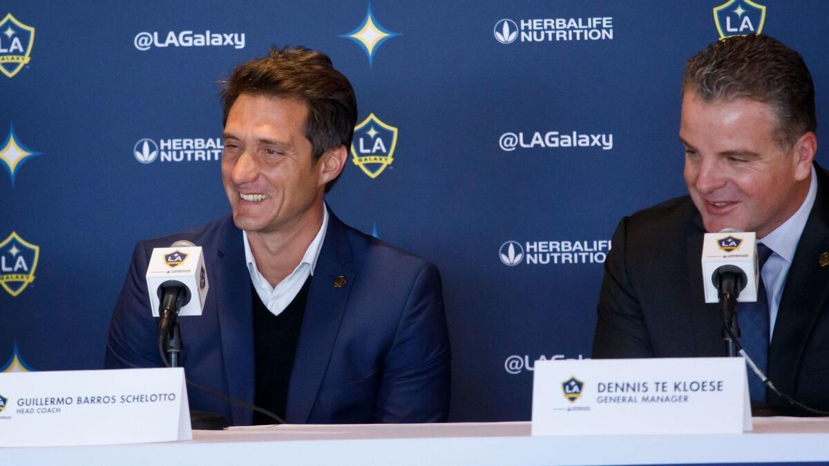 Galaxy coach Guillermo Barros Schelotto, left, and general manager Dennis te Kloese at a news conference Jan. 3 in Carson.