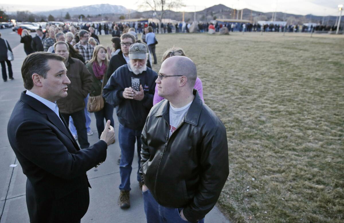 Ted Cruz with voter Mark Gonda outside a Reno caucus site.