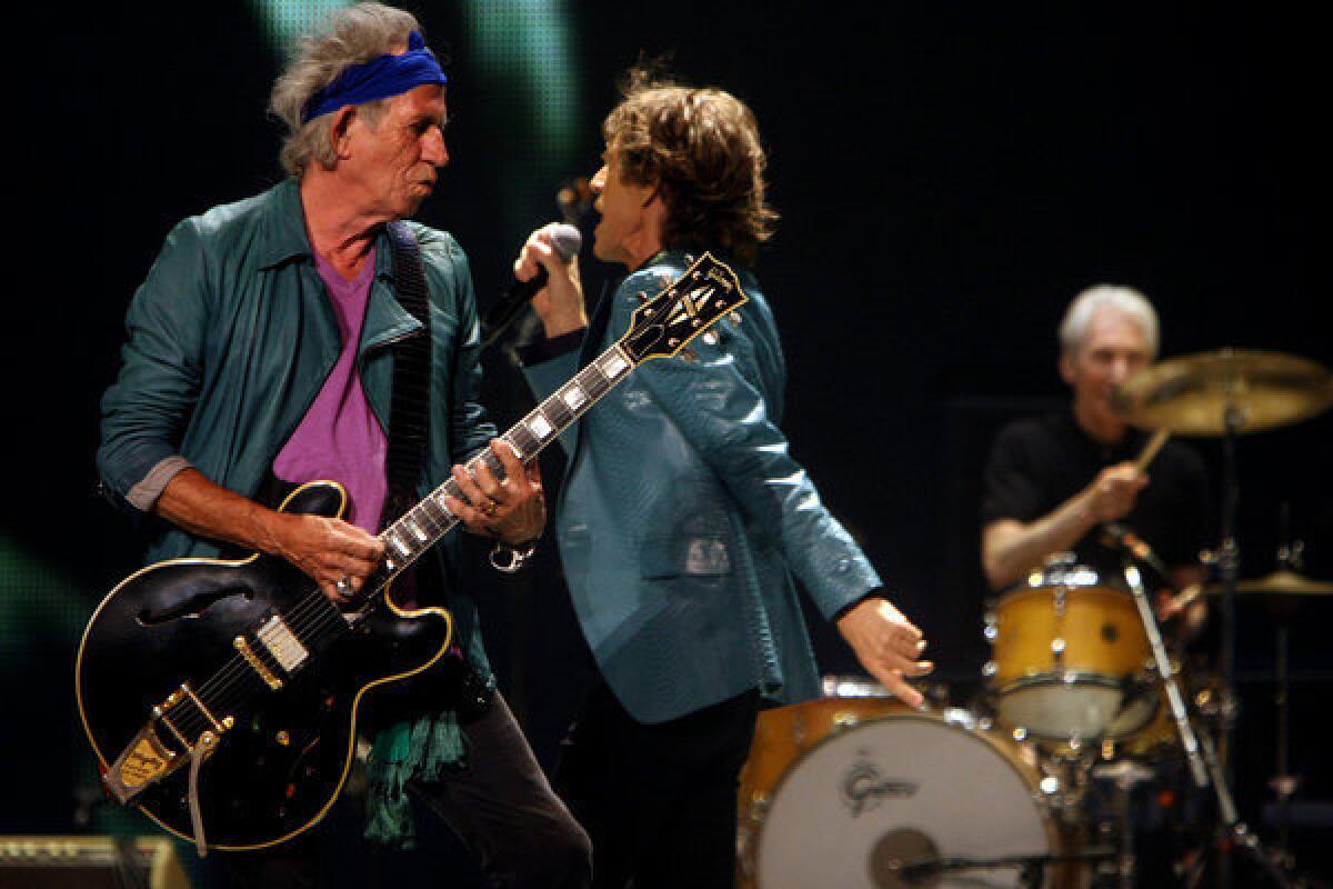 Keith Richards, Mick Jagger and Charlie Watts of the Rolling Stones perform at the Honda Center in Anaheim last Wednesday.