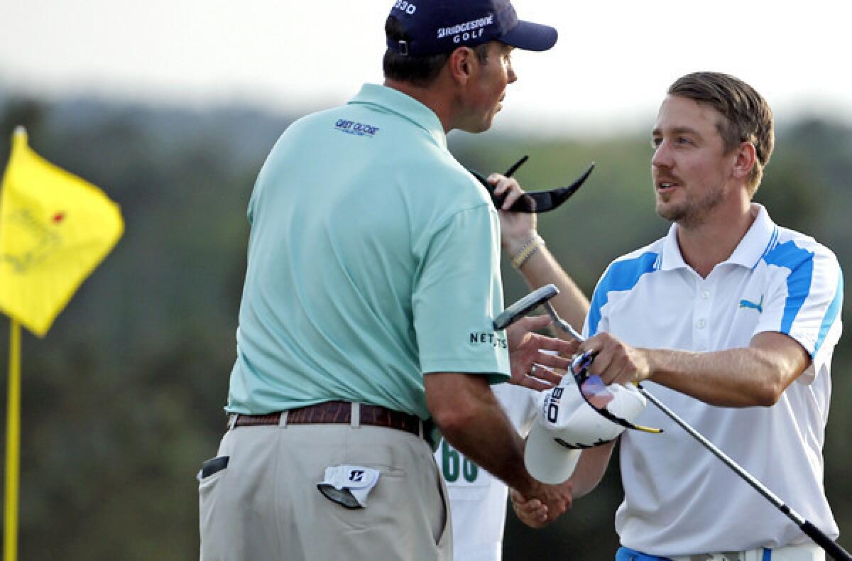 American Matt Kuchar, left, and Jonas Blixt of Sweden congratulate one another after completing the final round of the Masters on Sunday at Augusta National Golf Club.