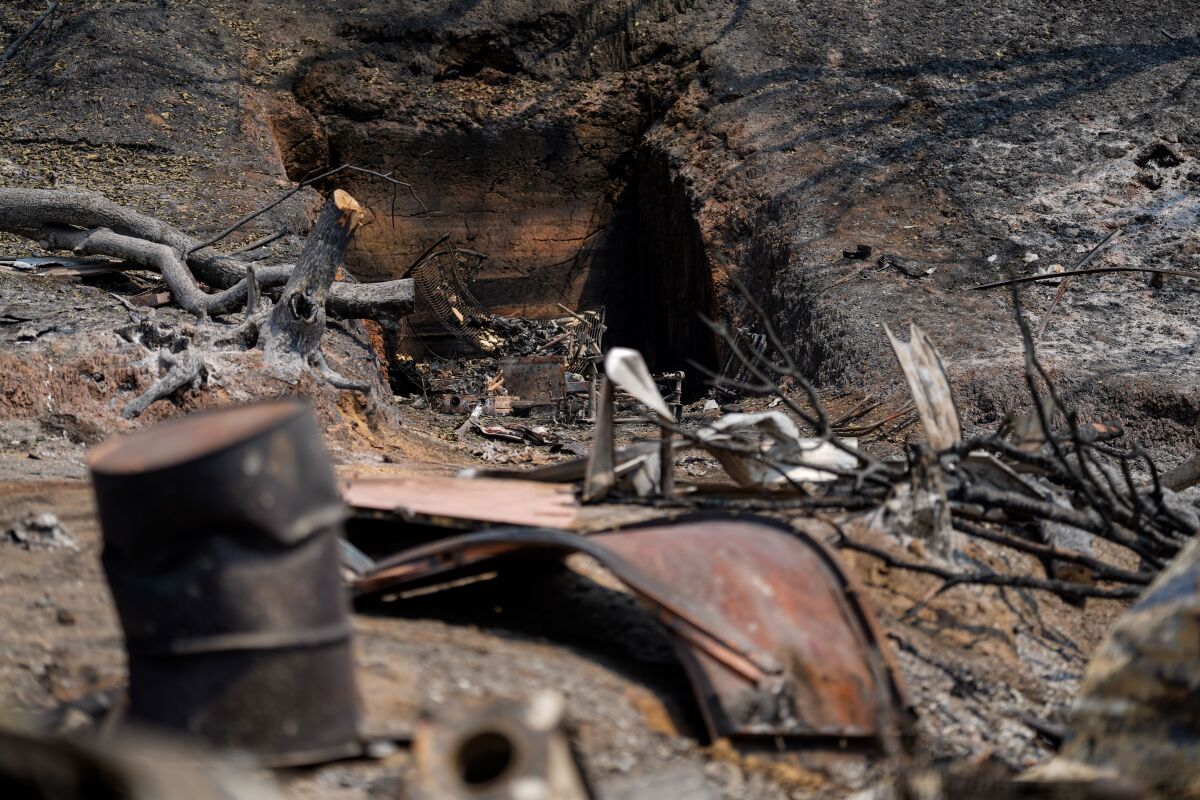 Wreckage lies at a property along California 128 where the LNU Lightning Complex fire tore through last week.