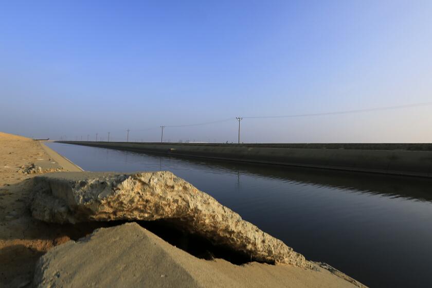 Many of the groundwater basins in the San Joaquin Valley are stressed, according to a new state report. Above, cracked concrete on the Delta Mendota Canal near Los Banos, where the land is sinking.