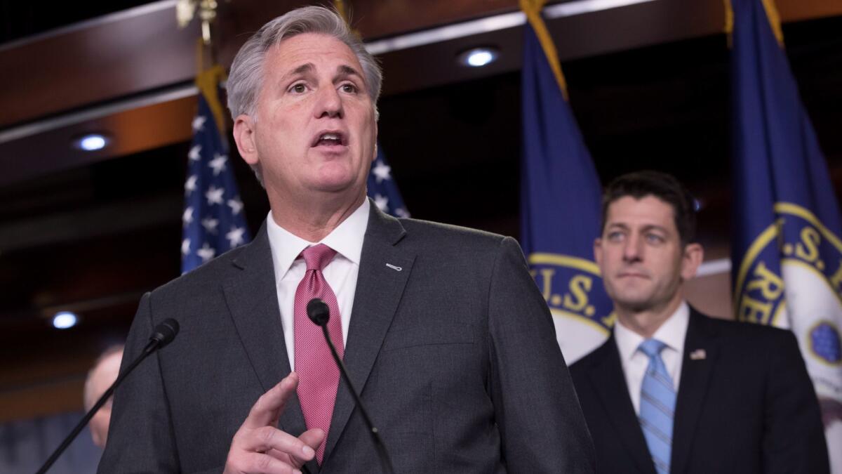 House Majority Leader Kevin McCarthy (R-Bakersfield), left, joined by House Speaker Paul D. Ryan (R-Wis.), speaks about the Republican tax plan at a news conference on Capitol Hill on Tuesday.