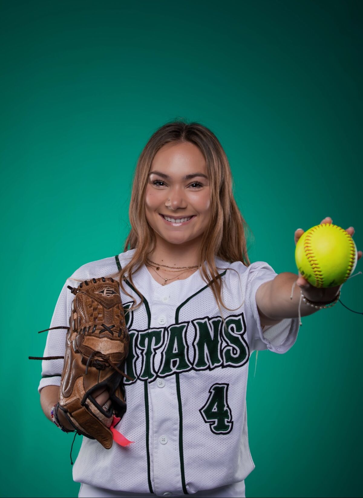 Poway High softball centerfielder Hailey Burns writes "GRIT" on her arm as a daily reminder of the mental side of the game. 