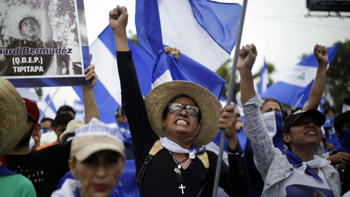 People participate in a march calling for President Daniel Ortega to be ousted in Managua, Nicaragua, on July 23, 2018.