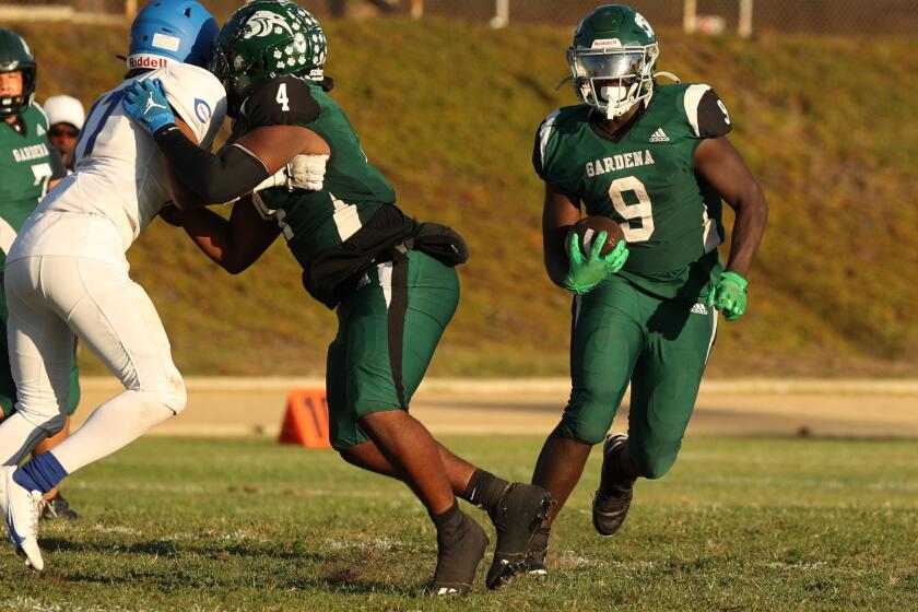 Gardena, CA - August 29: Gardena High Panther Running Back Xavier Grant runs down the field during a game against the Crenshaw High School Cougars which lead to a 52-0 win for the Panthers at Gardena High School on Thursday, Aug. 29, 2024 in Gardena, CA. (Michael Blackshire / Los Angeles Times)