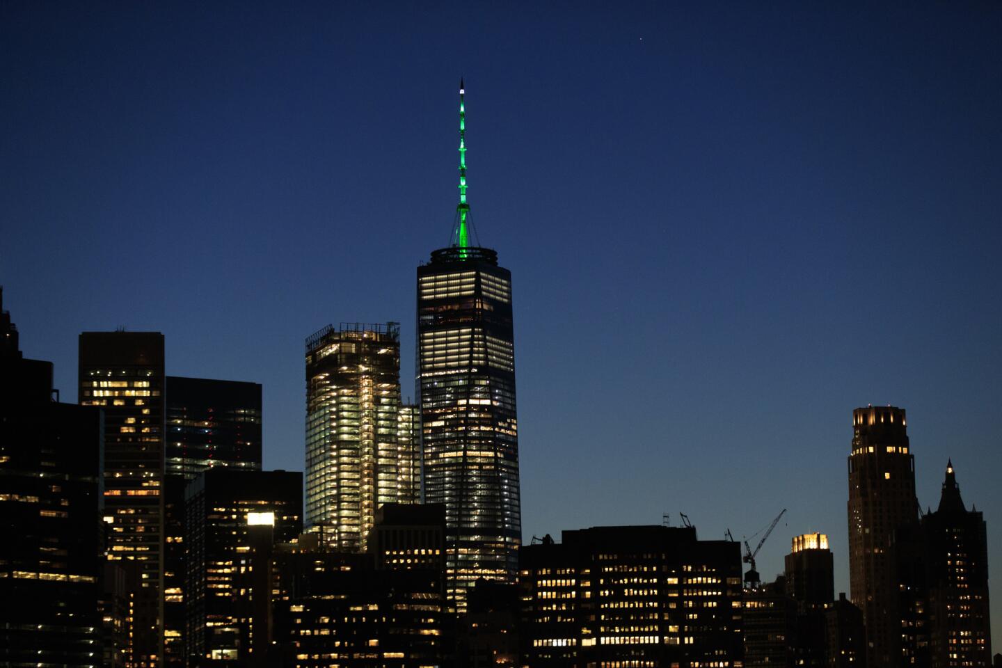 Cities glow green in support of Paris climate agreement