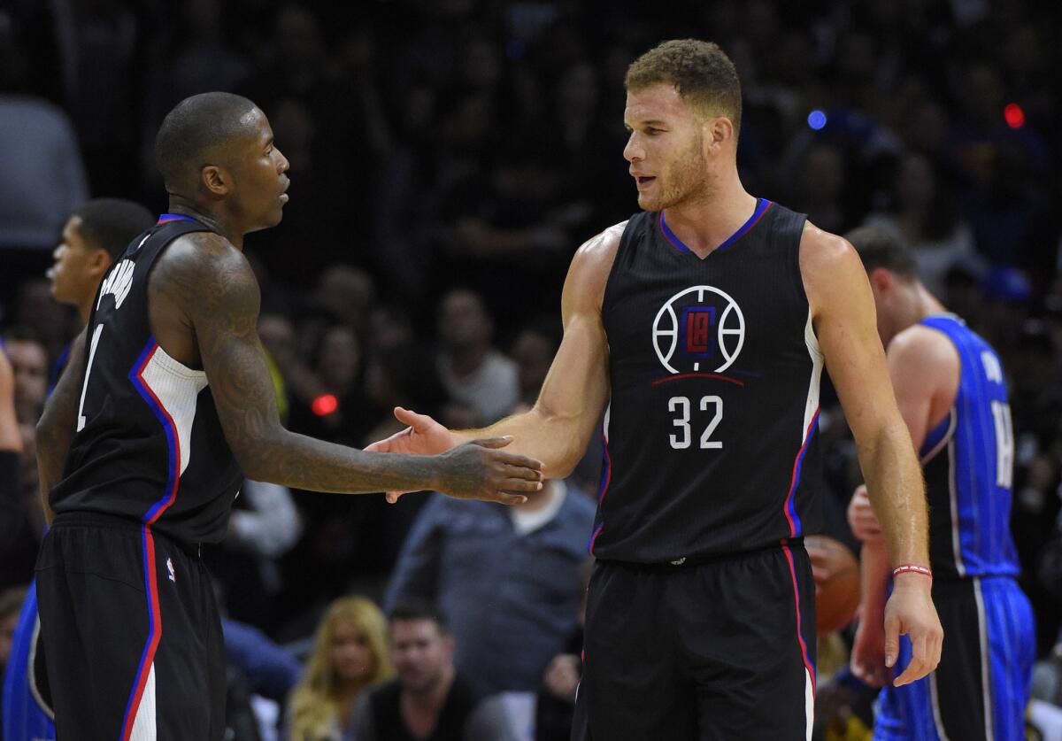 Clippers forwards Lance Stephenson and Blake Griffin congratulate each other during the second half of a a game against the Orlando Magic on Dec. 5.
