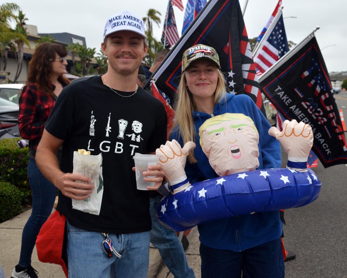 Jager Schmidt of Newport Beach and Millan Sekosky of Arizona turned out Saturday to support former president Trump.
