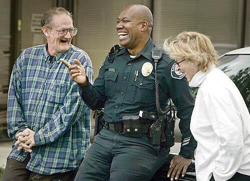 Santa Ana Police Officer Rufus Tanksley meets with John Martin, 54, and Marlene Gammelgard, 52, a homeless couple Tanksley befriended and has helped to reclaim some of their former life.