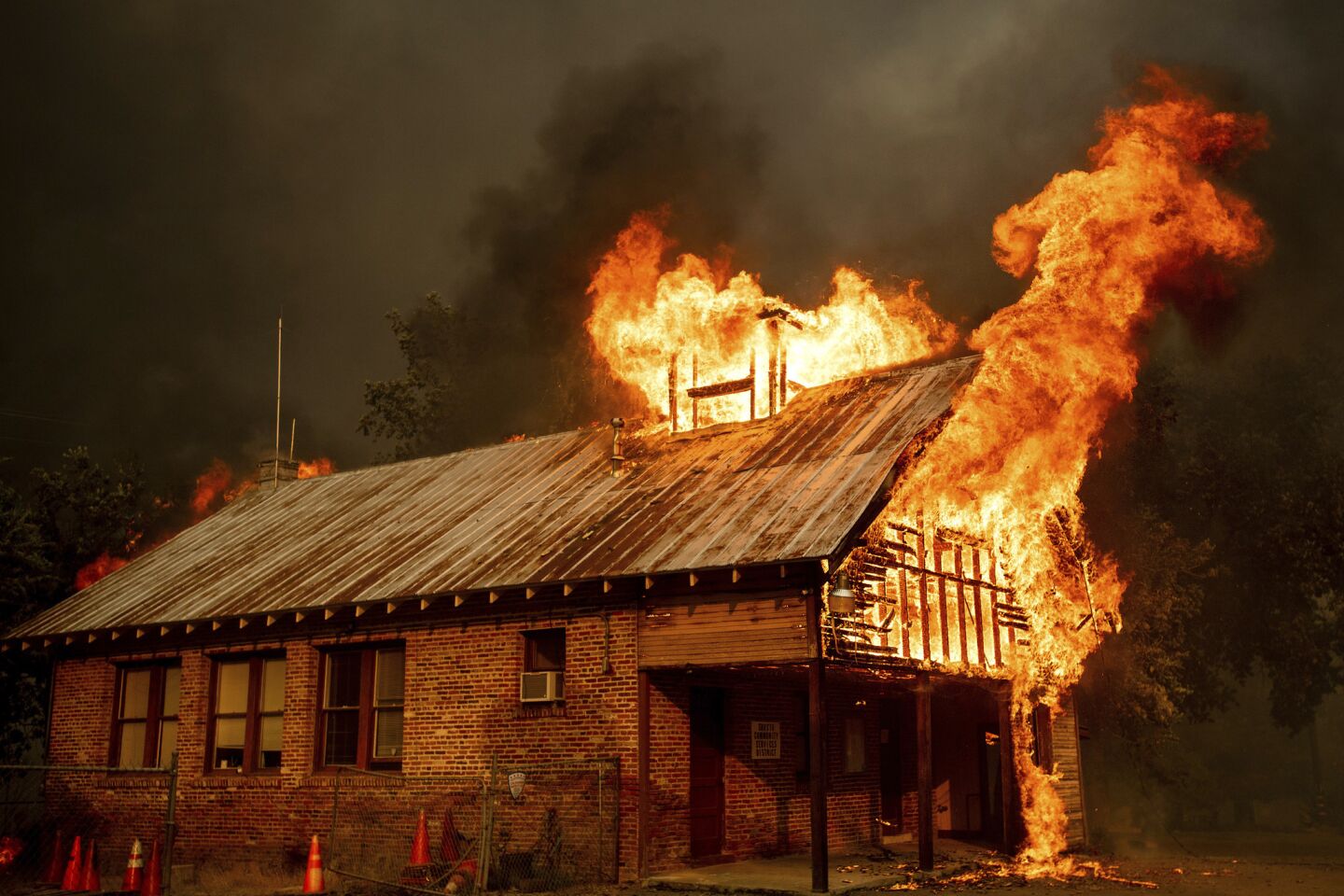 A historic schoolhouse burns as the Carr fire tears through Shasta on July 26.