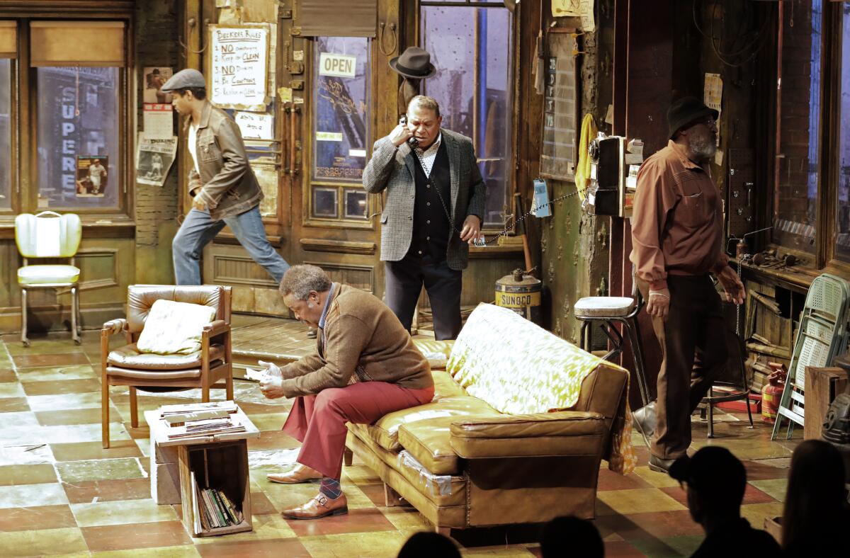 Ray Anthony Thomas (seated) along with, from left, Amari Cheatom,  Keith Randolph Smith and Steven Anthony Jones in August Wilson’s “Jitney” directed by Ruben Santiago-Hudson at the Mark Taper Forum. 