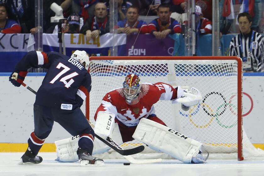 U.S. forward T.J. Oshie takes a shot against Russian goaltender Sergei Bobrovsky during a shootout in a men's ice hockey game at the 2014 Winter Olympics in Sochi, Russia. Oshie scored the clinching goal and the U.S. won, 3-2.