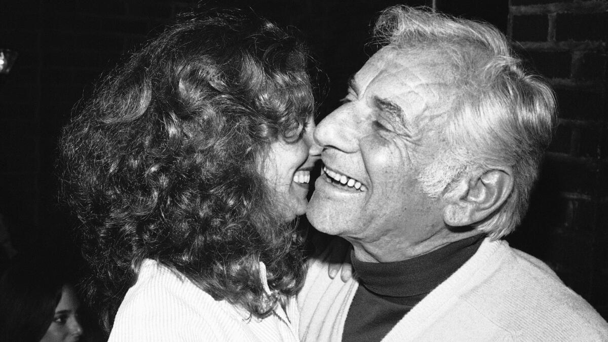 Jamie Bernstein hugs her father in New York in 1980.