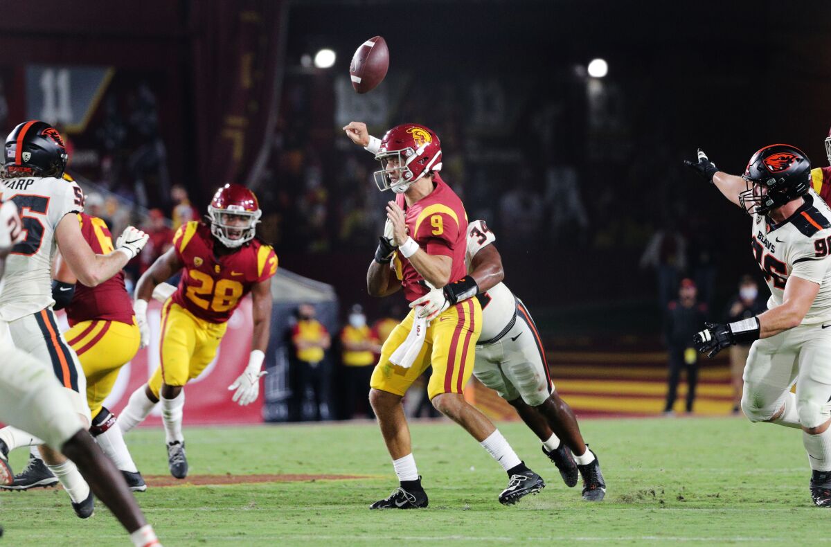 Oregon State linebacker Avery Roberts forces USC quarterback Kedon Slovis to fumble.