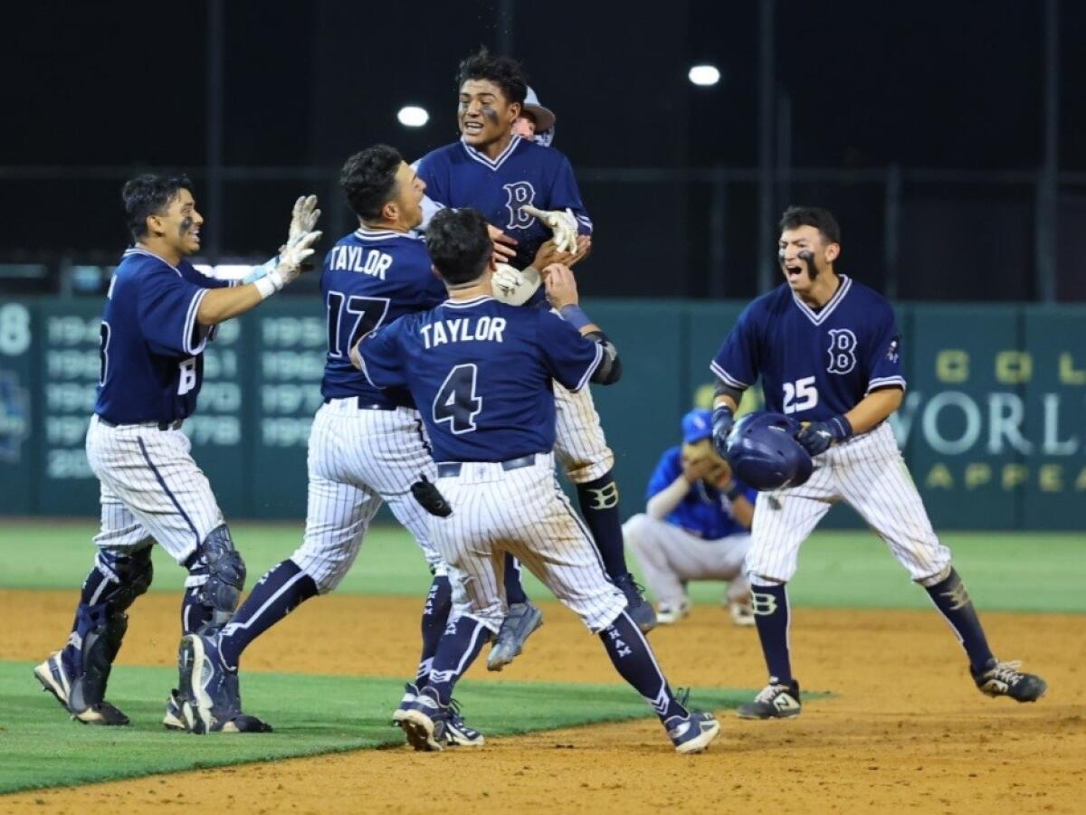 Birmingham's Johan Ceja gets surrounded by teammates after delivering walk-off hit for 2-1 win over El Camino Real.