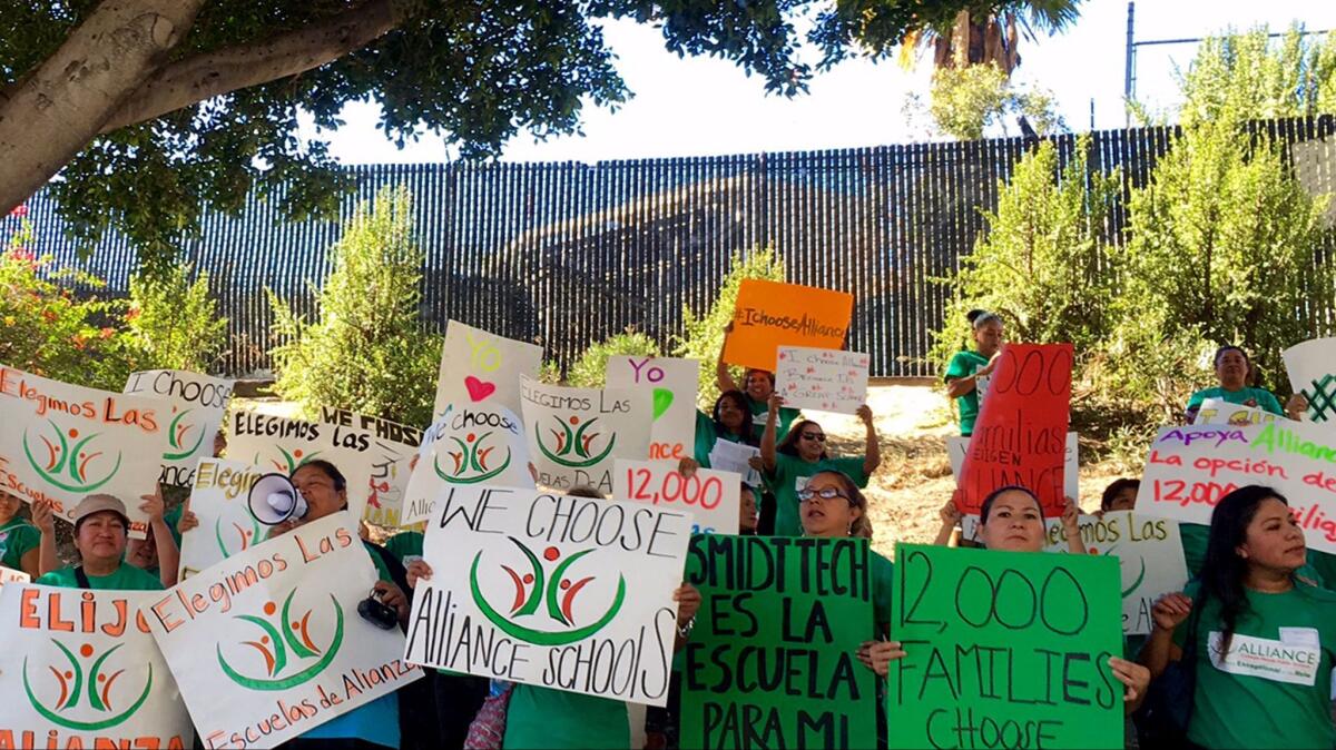 Supporters of the Alliance College-Ready charter school network rally outside L.A. Unified headquarters in 2015. Alliance is among the charter groups resisting district rules that go beyond what the state requires.