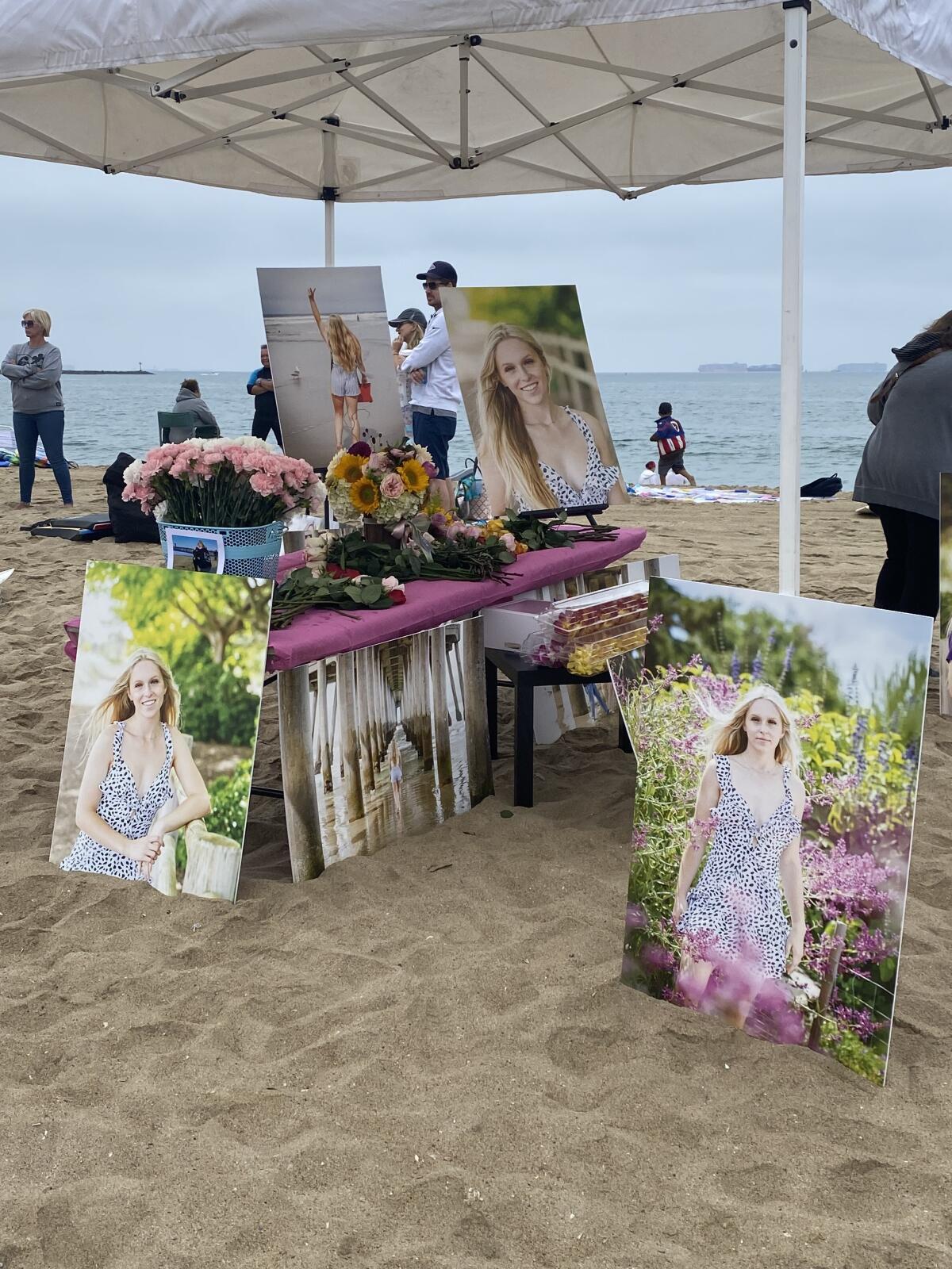 A memorial of photos and flowers is set up for Rylee Goodrich at Seal Beach in Orange County