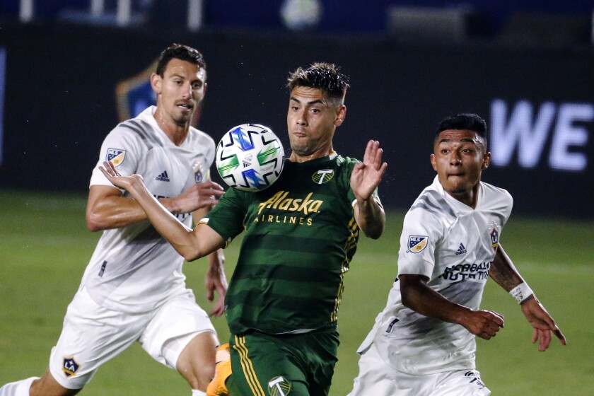 Portland Timbers forward Felipe Mora controls the ball.
