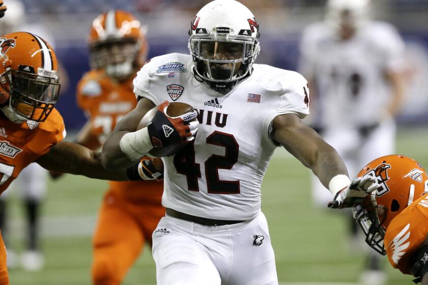 Northern Illinois running back Cameron Stingily (42) picks up 42 yards against Bowling Green in the second half Friday night.