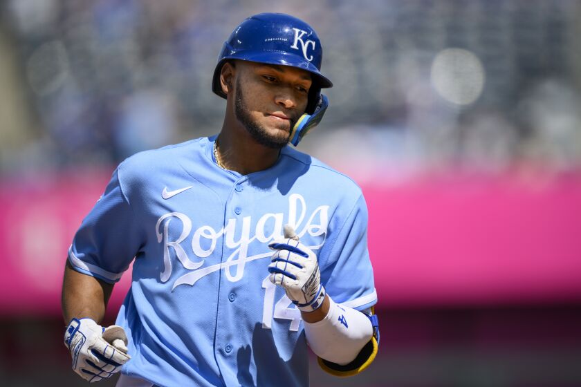 Kansas City Royals' Edward Olivares rounds the bases after hitting a home run against the Washington Nationals during the eighth inning of a baseball game, Sunday, May 28, 2023, in Kansas City, Mo. (AP Photo/Reed Hoffmann)