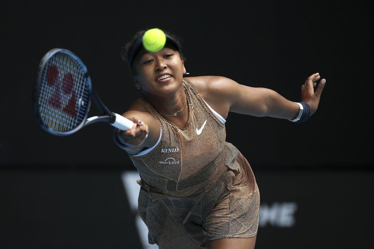 Naomi Osaka of Japan plays a forehand during her singles match against Alize Cornet of France at Summer Set tennis tournament ahead of the Australian Open in Melbourne, Australia, Tuesday, Jan. 4, 2022. (AP Photo/Hamish Blair)