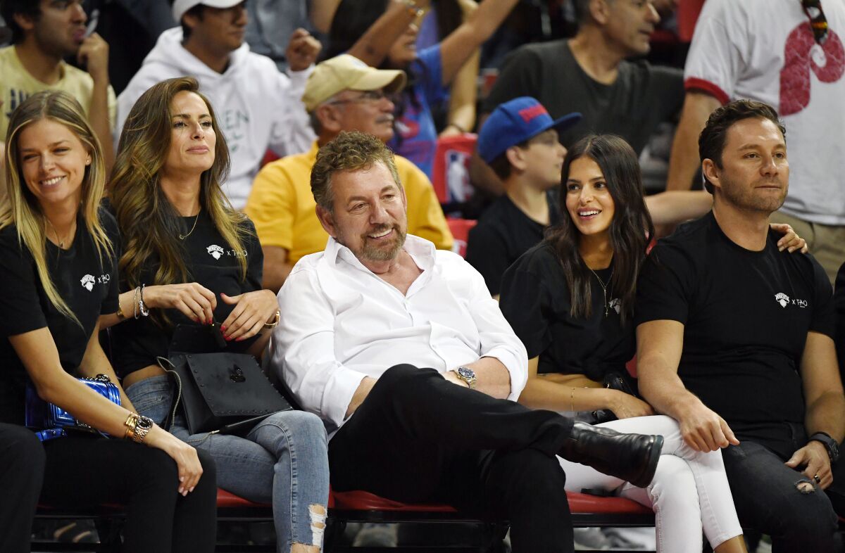 New York Knicks owner James Dolan, middle, attend a Las Vegas summer league game July 7, 2019.