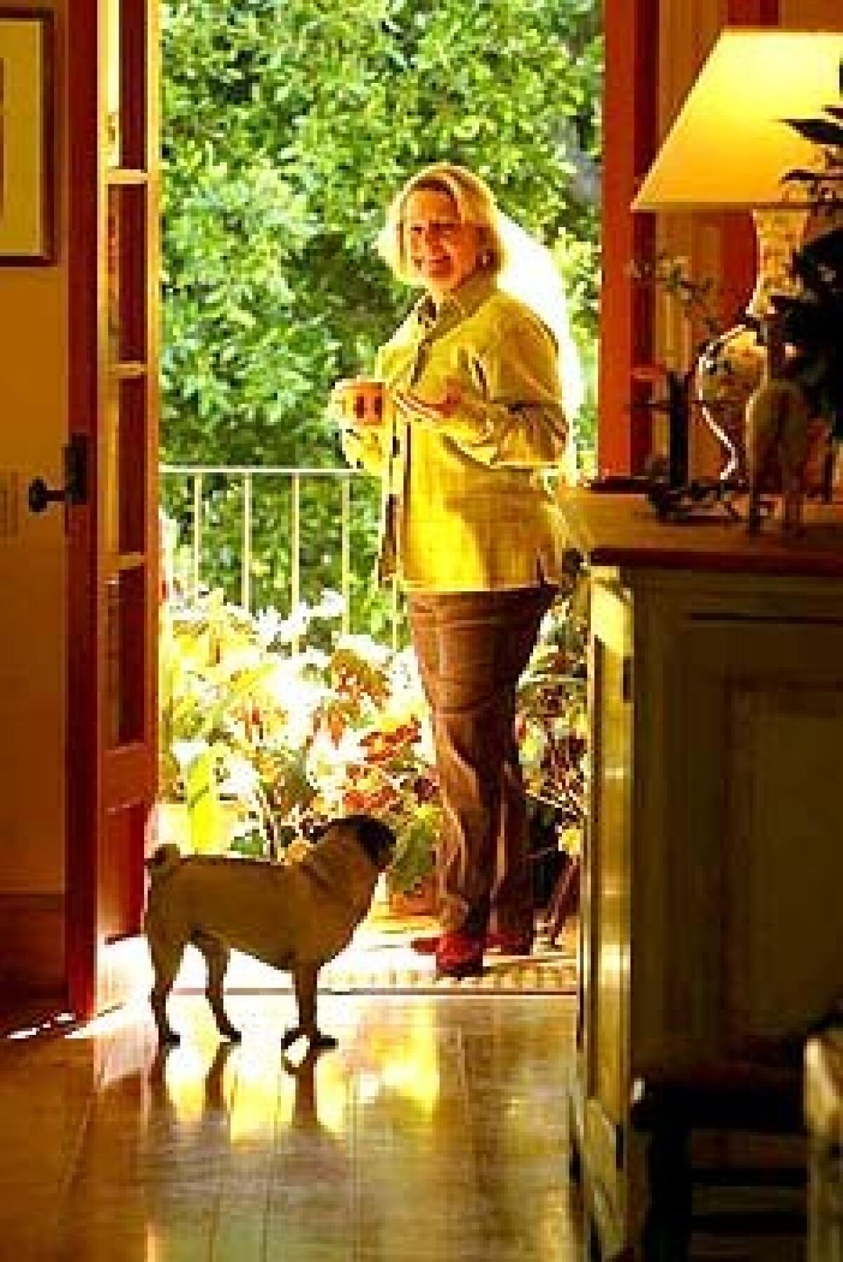 Nancy Goslee Power and pug Lola at the home Power designed in Santa Monica.