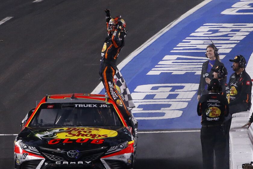 LOS ANGELES, CALIF. - FEB. 5, 2023. Martin Truex Jr. celebrates after driving his Toyota Camry.