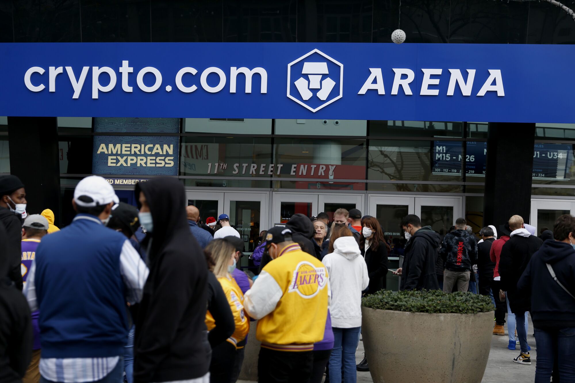 Fans stand outside Crypto.com Arena before the start of Sunday's game between the Lakers and Brooklyn Nets.