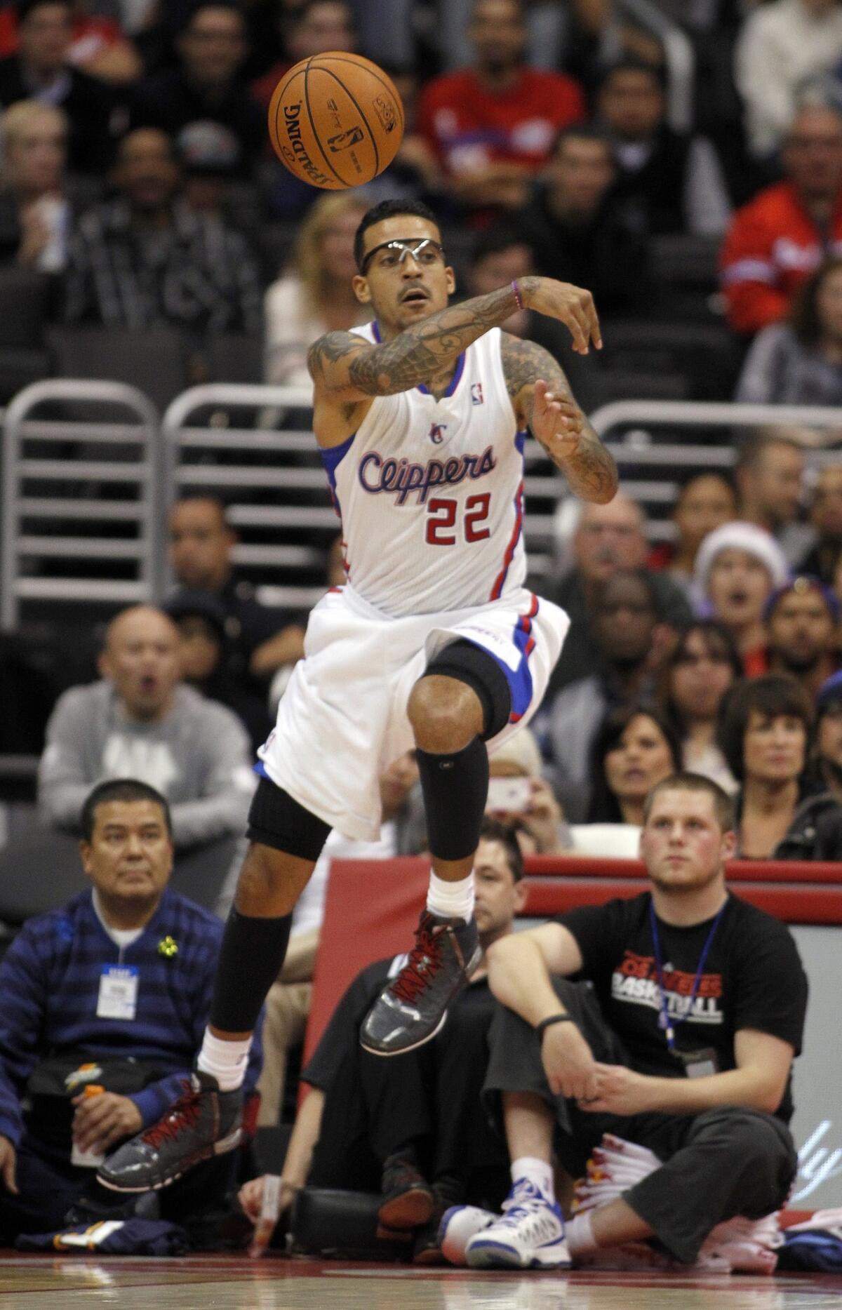 Clippers forward Matt Barnes passes during the team's 112-91 win Saturday over the Denver Nuggets. Barnes' season has been interrupted by injuries.