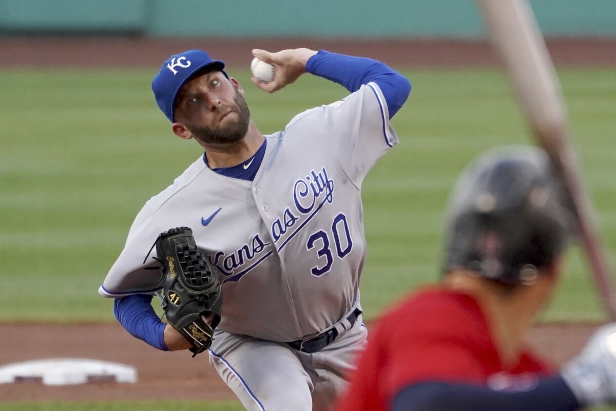 In Kansas City Royals uniform, Danny Duffy throws a pitch.